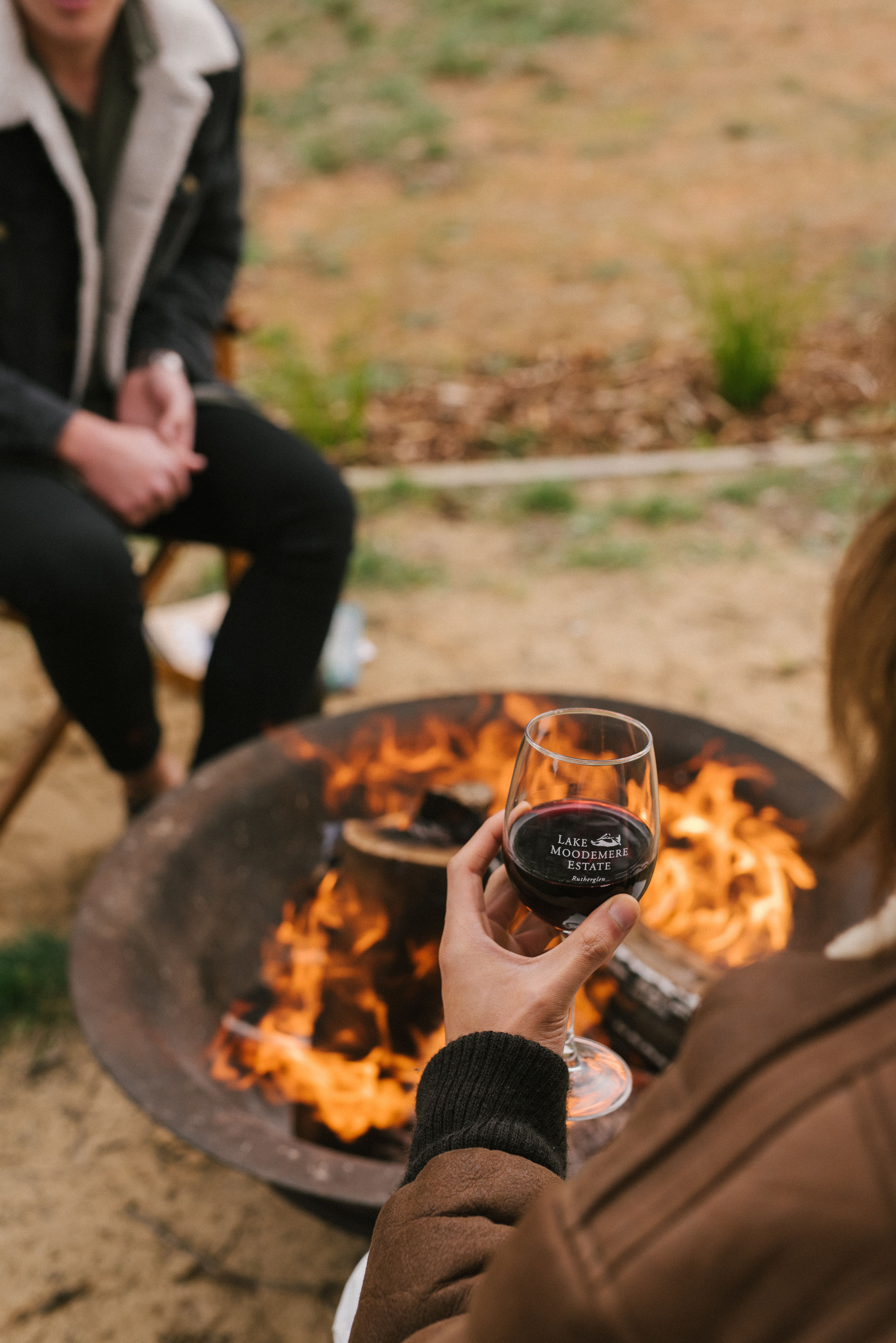 Couple sitting around a fire