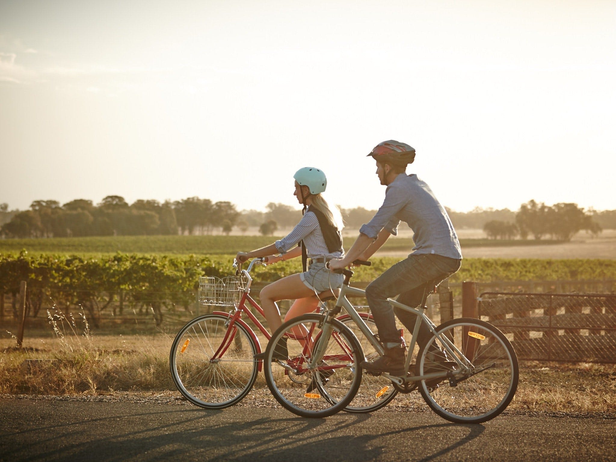 two people riding bikes